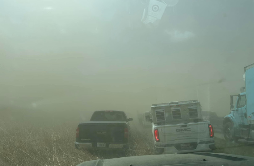  A view of vehicles in a dust storm, which cut visibility to near zero and triggered a series of chain-reaction crashes involving dozens of vehicles, on a highway in Springfield, Illinois, U.S. May 1, 2023 in this picture obtained from social media. (photo credit: Thomas DeVore via TMX/via REUTERS)