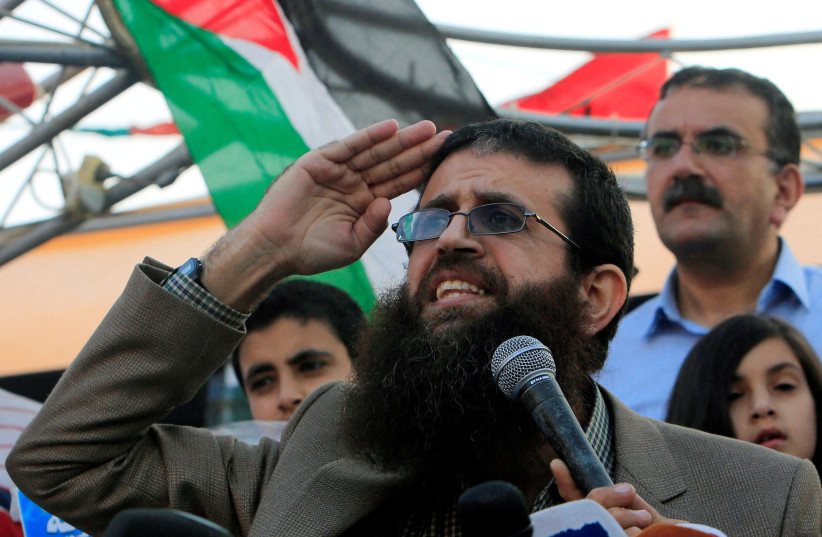 FILE PHOTO: Palestinian Islamic Jihad leader Khader Adnan gestures as he speaks during a rally honoring him following his release, near the West Bank city of Jenin July 12, 2015.  (photo credit: REUTERS/ABED OMAR QUSINI/FILE PHOTO)