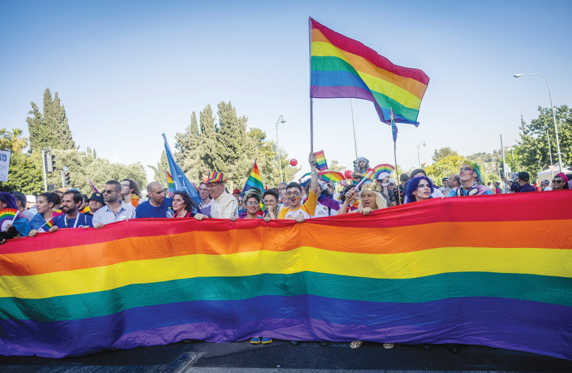  MARCHERS TAKE part in last year’s Jerusalem Pride Parade. ‘I strive to be an ally to the LGBTQ+ community not despite being a religious Jew, but rather because I am a religious Jew,’ says the writer.  (photo credit: YONATAN SINDEL/FLASH90)
