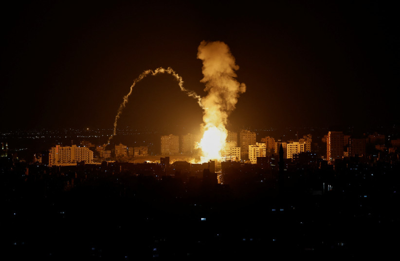  Smoke rises following an Israeli air strike in Gaza May 2, 2023. (credit: REUTERS/MOHAMMED SALEM)