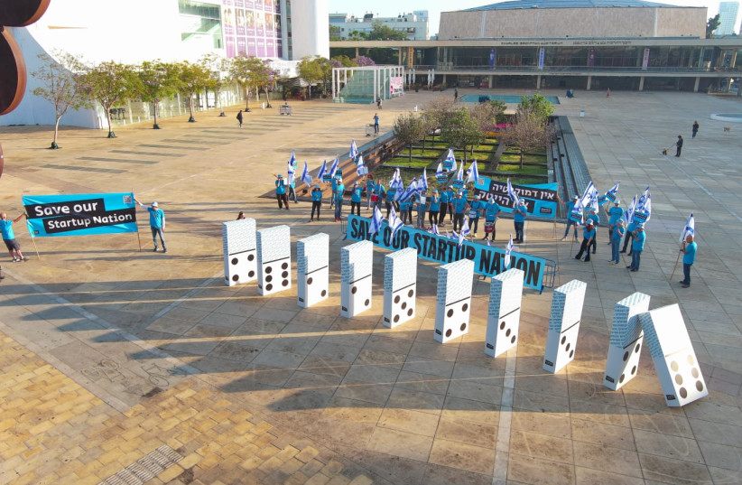 Representatives of Israel's hi-tech sector constructed a display entitled, ''If hi-tech falls, we all fall'' at HaBima Square in Tel Aviv on May 4, 2023 as part of the national ''Day of Equality.'' (credit: TALI MELAMED)