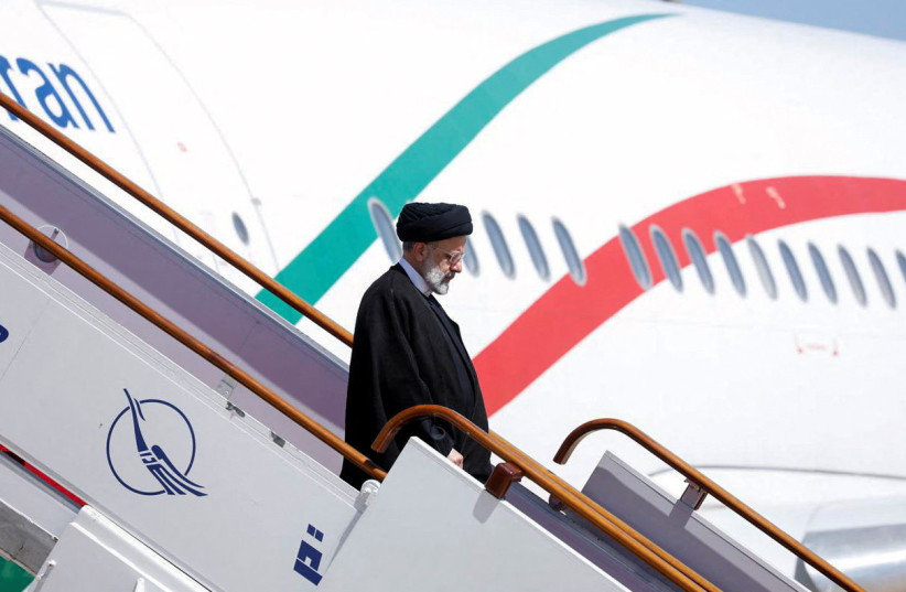  Iranian President Ebrahim Raisi disembarks from a plane upon arrival at Damascus airport, Syria May 3, 2023. (photo credit: YAMAM AL SHAAR/REUTERS)