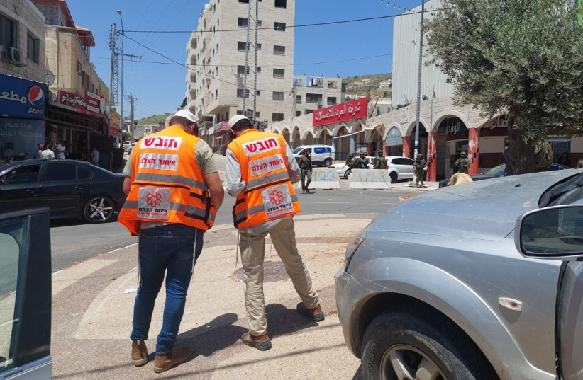  United Hatzalah medics at the scene of the May 4, 2023 Huwara stabbing.  (photo credit: UNITED HATZALAH‏)