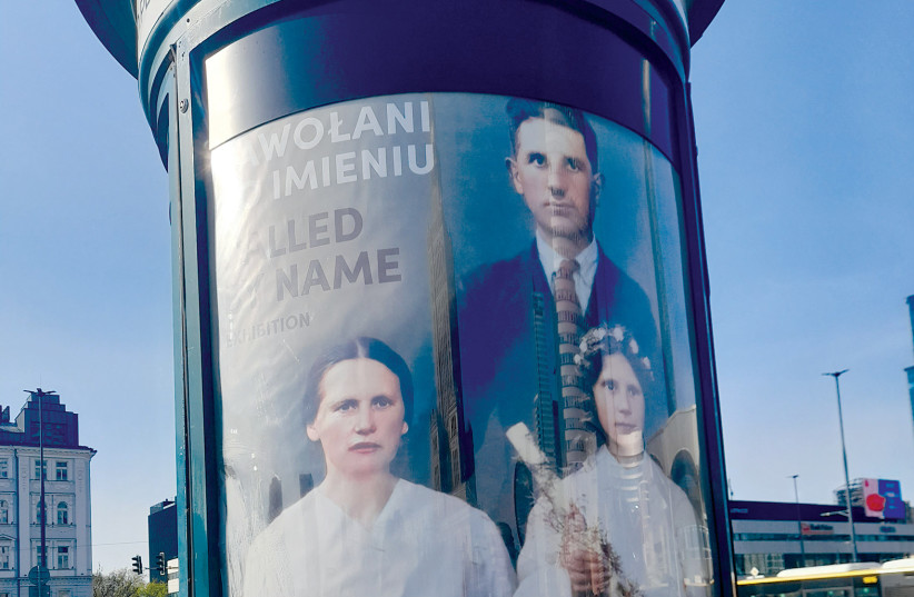  A BILLBOARD in central Warsaw exhorts the public to visit an exhibition about Poles murdered by the Germans for helping Jews. (credit: BARRY DAVIS)