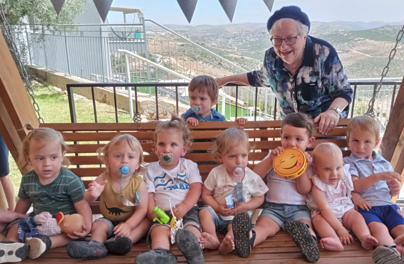  AT HER 85th birthday party in Peduel with eight of her great-grandchildren.  (credit: Courtesy Sarah Goodman)