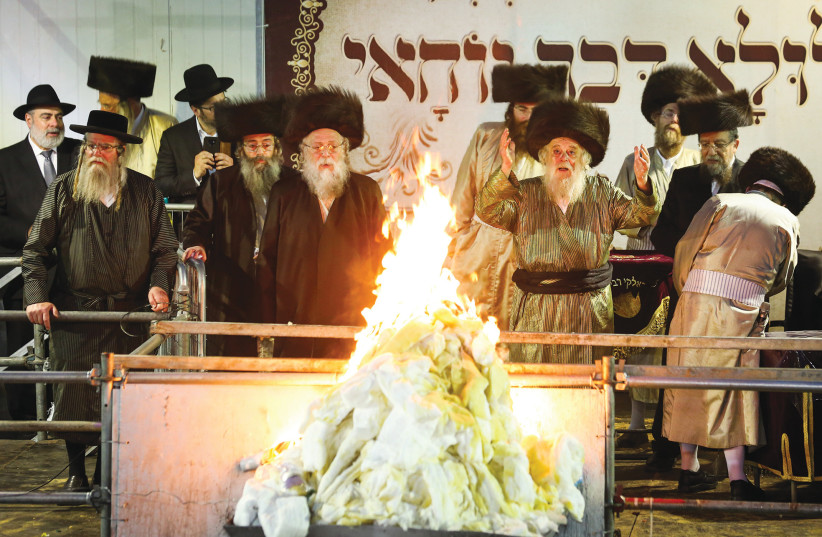  DAVID KAHN, grand rabbi of the Toldos Aharon hassidic dynasty, lights a bonfire during Lag Ba’omer celebrations on Mount Meron in May 2019.  (photo credit: David Cohen/Flash90)