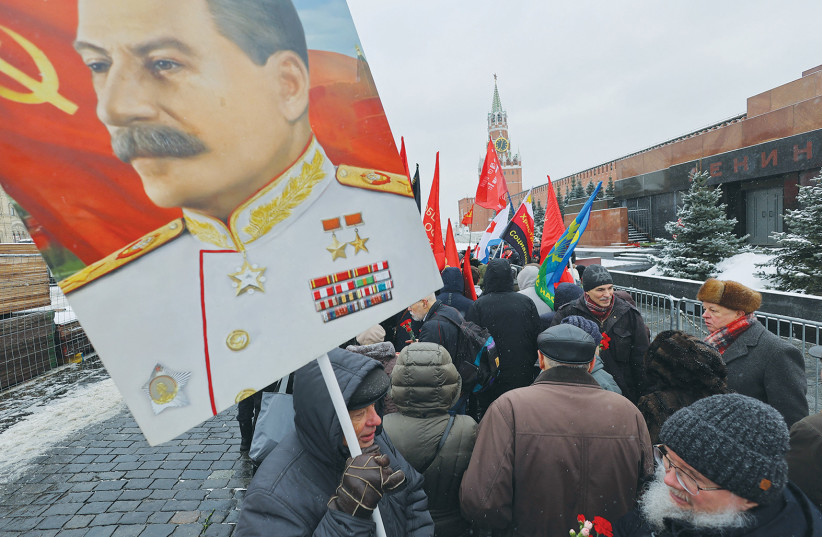  SUPPORTERS OF the Russian Communist Party attend a ceremony marking the 70th anniversary of the death of Soviet leader Josef Stalin, in Moscow’s Red Square, in March.  (photo credit: EVGENIA NOVOZHENINA/REUTERS)