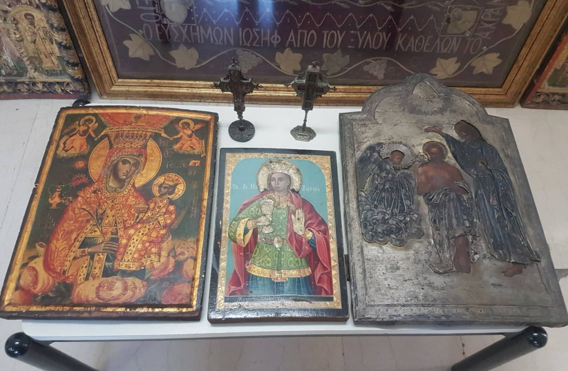 A view of several religious icons that were among the stolen artefacts that were recovered during a crackdown on international art trafficking, at an unknown location, in Greece, in this undated handout picture obtained by Reuters on May 4, 2023 (photo credit: Courtesy of Europol/Handout via REUTERS )