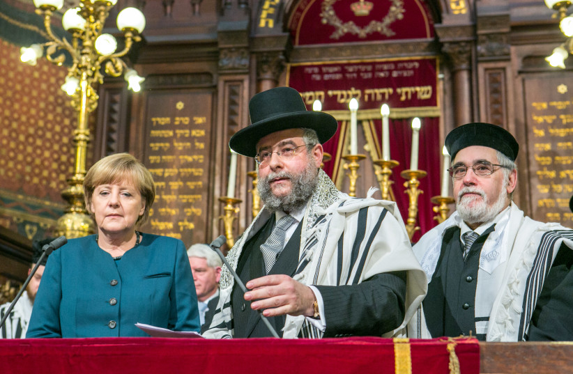  PRESENTING THE CER Prize to then-German chancellor Angela Merkel, together with Brussels’ Chief Rabbi Albert Guigui, 2013 (photo credit:  Eli Itkin/CER)