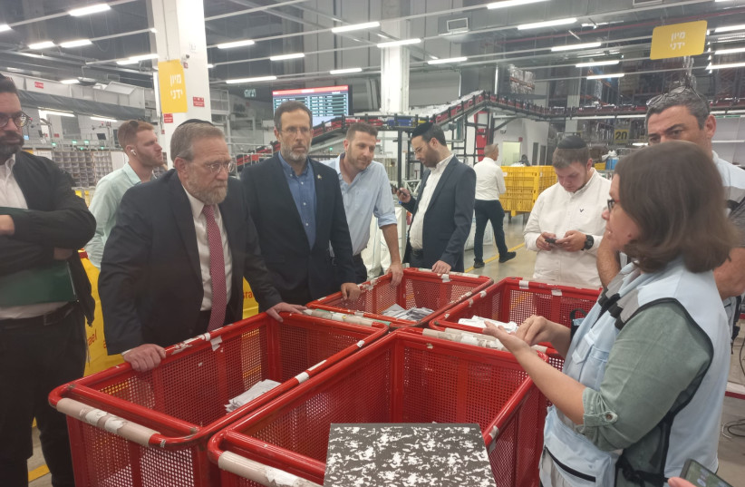 Members of the Knesset Special Committee for Public Inquiries on a tour of Israel Post facilities, May 4, 2023. (credit: KNESSET SPOKESMAN'S OFFICE)