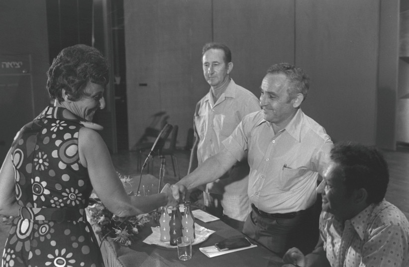  RUTH BONDY is congratulated by Amos Horev, president of the Technion-Israel Institute of Technology, in 1974, on her winning the Yitzhak Sadeh Prize for the book ‘The Emissary: The Life of Enzo Sereni.’  (photo credit: YAACOV SAAR/GPO)