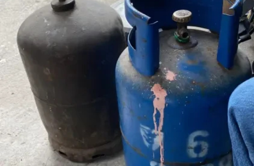  The gas cylinders found in the apartment in Romania where the father threatened to blow up his apartment. (credit: ISRAEL POLICE/VIA MAARIV)
