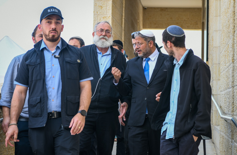  National Security Minister Itamar Ben-Gvir walks with Matityahu (Mati) Dan, chairman of the Ateret Cohanim organization after a meeting at the Western Wall, in Jerusalem's Old City, May 7, 2023 (photo credit: ARIE LEIB ABRAMS/FLASH 90)