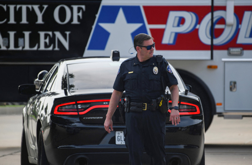  An officer with the Allen Police Department man the mobile command post the day after a gunman shot multiple people at the Dallas-area Allen Premium Outlets mall in Allen, Texas, US May 7, 2023. (photo credit: REUTERS/Jeremy Lock)