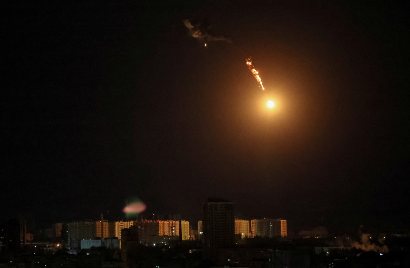 An explosion of a drone is seen in the sky over the city during a Russian drone strike, amid Russia's attack on Ukraine, in Kyiv, Ukraine May 8, 2023. (photo credit: GLEB GARANICH/REUTERS)