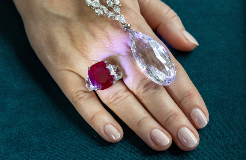 Sunrise Ruby and Diamond ring of 25 carats by Cartier and a 90 carat Briolette of India Diamond Necklace by Harry Winston, are seen during a preview of the 700-piece jewellery collection of the late Austrian billionaire Heidi Horten at Christie's before the auction sale in Geneva, Switzerland, May 8 (credit: DENIS BALIBOUSE/REUTERS)