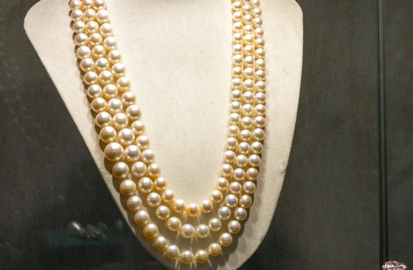 A Three Strand Natural Pearl Necklace by Harry Winston is seen during a preview of the 700-piece jewellery collection of the late Austrian billionaire Heidi Horten at Christie’s before the auction sale in Geneva, Switzerland, May 8, 2023 (credit: DENIS BALIBOUSE/REUTERS)