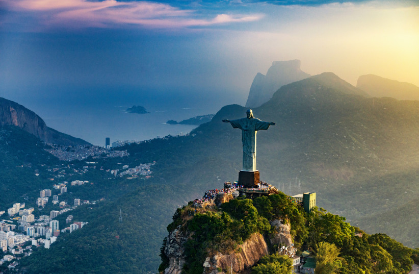  Christ The Redeemer statue in Rio De Janeiro. Sunset, shot from the helicopter (photo credit: INGIMAGE)