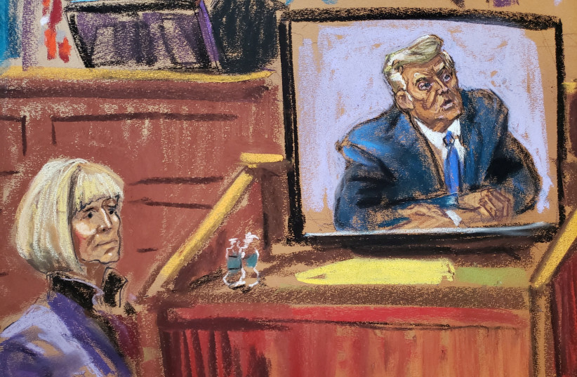 Former Elle magazine advice columnist E. Jean Carroll watches as a former U.S. president Donald Trump's video deposition is played in court during a civil trial where Carroll accuses the former US president in a civil lawsuit of raping her in a department store dressing room in the mid-1990s (photo credit: REUTERS)
