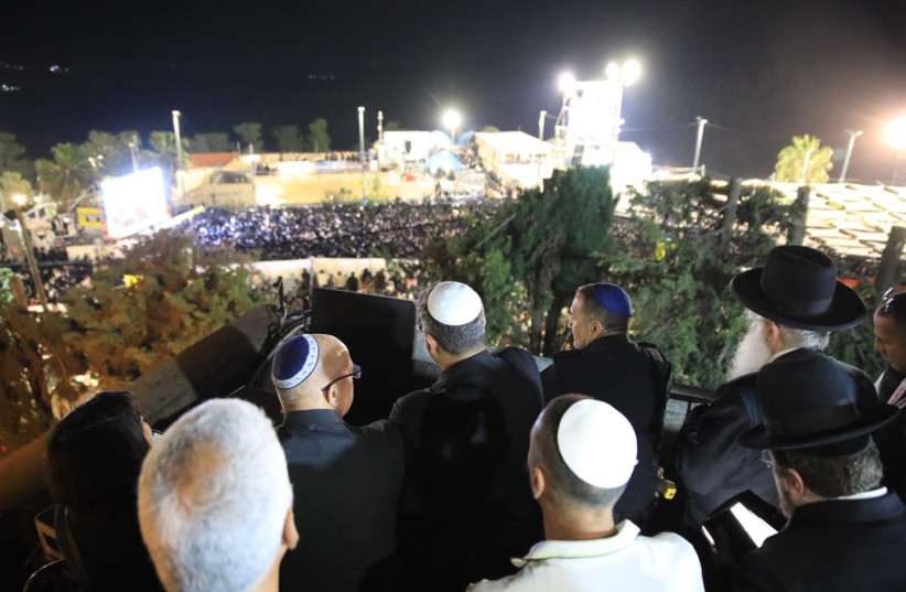  National Security Minister Itamar Ben-Gvir, MK Tzvika Fogel and Police Chief Yaakov Shabtai watching the candle lighting ceremony on Mount Meron, May 8, 2023. (credit: OTZMA YEHUDIT)