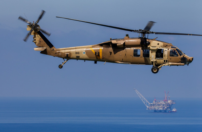 An IDF Black Hawk helicopter is seen flying above the Leviathan gas field in an aerial shot taken April 2023 (credit: MARC ISRAEL SELLEM/THE JERUSALEM POST)