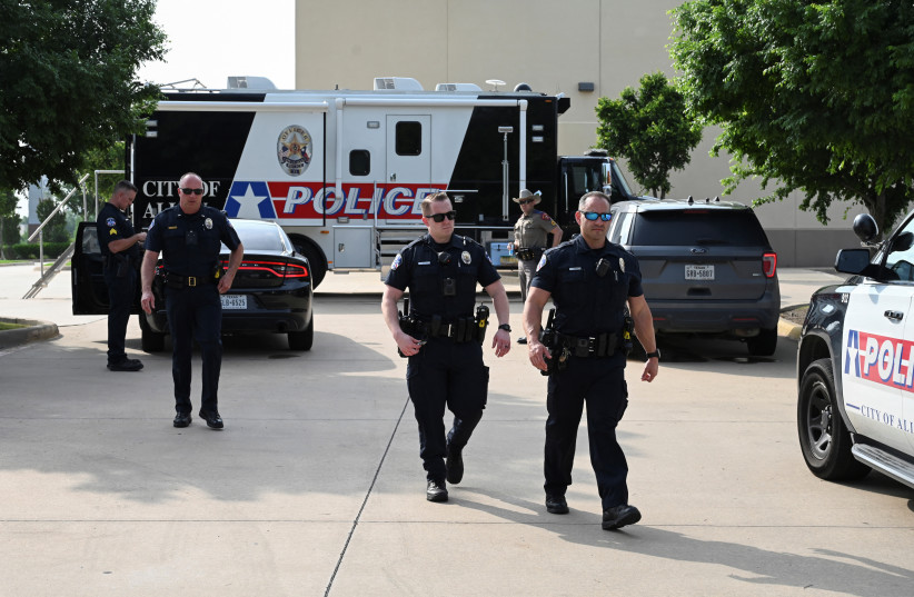  Officers with the Allen Police Department man the mobile command post the day after a gunman shot multiple people at the Dallas-area Allen Premium Outlets mall in Allen, Texas, U.S. May 7, 2023 (photo credit: REUTERS)