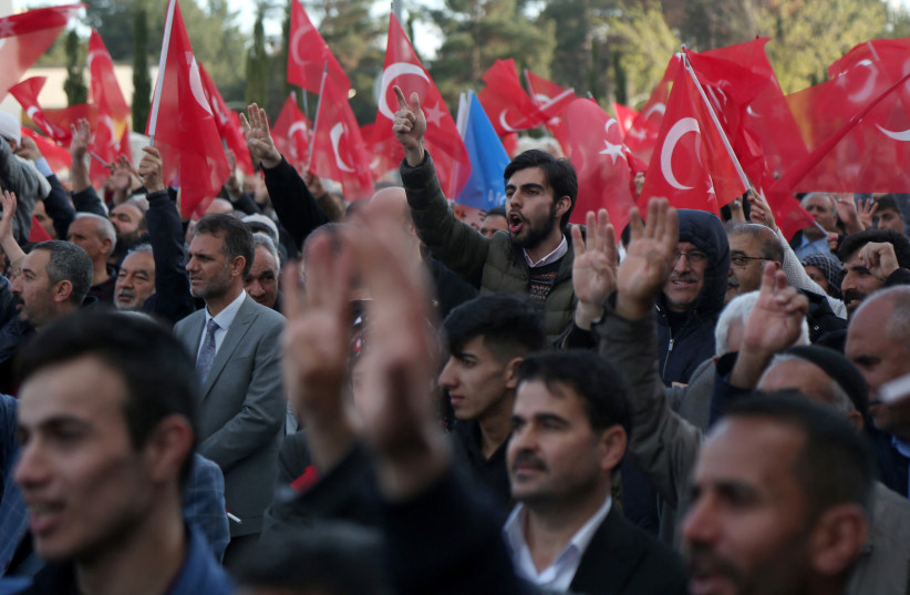  Supporters of Turkish President Tayyip Erdogan cheer as they listen to his speech during a ceremony in Diyarbakir, Turkey April 14, 2023. (credit: Sertac Kayar/Reuters)
