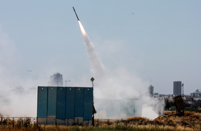  An Israeli Iron Dome anti-missile system is activated as rockets launched from the Gaza Strip, near Ashdod, Israel May 10, 2023 (credit: AMMAR AWAD/REUTERS)