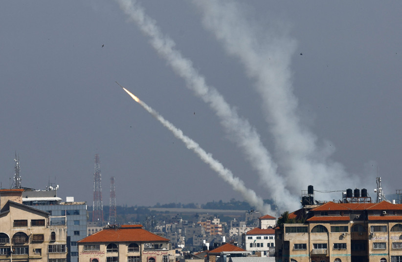  Rockets are fired from Gaza into Israel, in Gaza May 10, 2023 (credit: REUTERS/AMMAR AWAD)