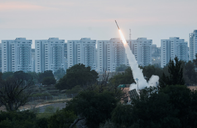  An Iron Dome launcher fires an interceptor missile as rockets are fired from Gaza, in Ashkelon, Israel May 10, 2023 (photo credit: REUTERS/AMIR COHEN)