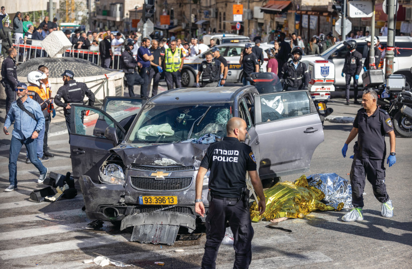  POLICE WORK at the scene of a car-ramming outside of Mahaneh Yehuda in Jerusalem last month. Terror fits into the category of jihad, which is a religious concept and not just a military one, says the writer (photo credit: YONATAN SINDEL/FLASH90)
