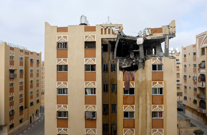  A damaged building, where Islamic Jihad commander Ali Ghali was killed in an Israeli strike, is seen in Khan Younis in the southern Gaza Strip May 11, 2023. (photo credit: IBRAHEEM ABU MUSTAFA/REUTERS)