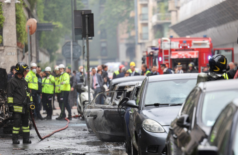  A firefighter works at the site of an explosion in the centre of Milan, Italy, May 11, 2023 (credit: REUTERS/CLAUDIA GRECO)