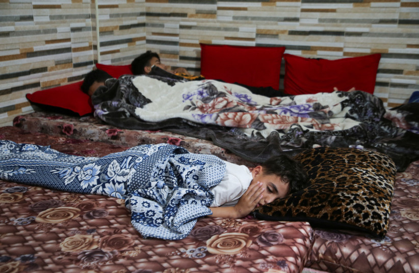  Palestinian children sleep next to one another in their house in Khan Younis in the southern Gaza Strip, May 10, 2023. (credit: REUTERS/BASSAM MASOUD)