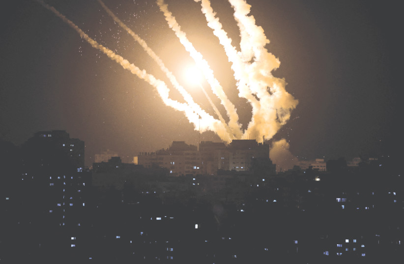  ROCKETS ARE fired from Gaza into Israel on Wednesday. (photo credit: MOHAMMED SALEM/REUTERS)