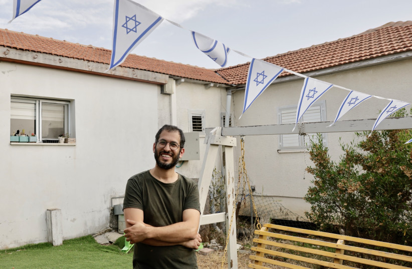  Ishai Trabelsi stands in the yard of his Sderot home amid the risk of rockets fired by Palestinian Islamic Jihad during Operation Shield and Arrow, May 11, 2023. (photo credit: MARC ISRAEL SELLEM/THE JERUSALEM POST)
