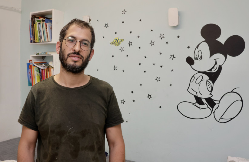  Ishai Trabelsi stands in the safe room of his Sderot home amid the risk of rockets fired by Palestinian Islamic Jihad during Operation Shield and Arrow, May 11, 2023. (credit: MARC ISRAEL SELLEM/THE JERUSALEM POST)
