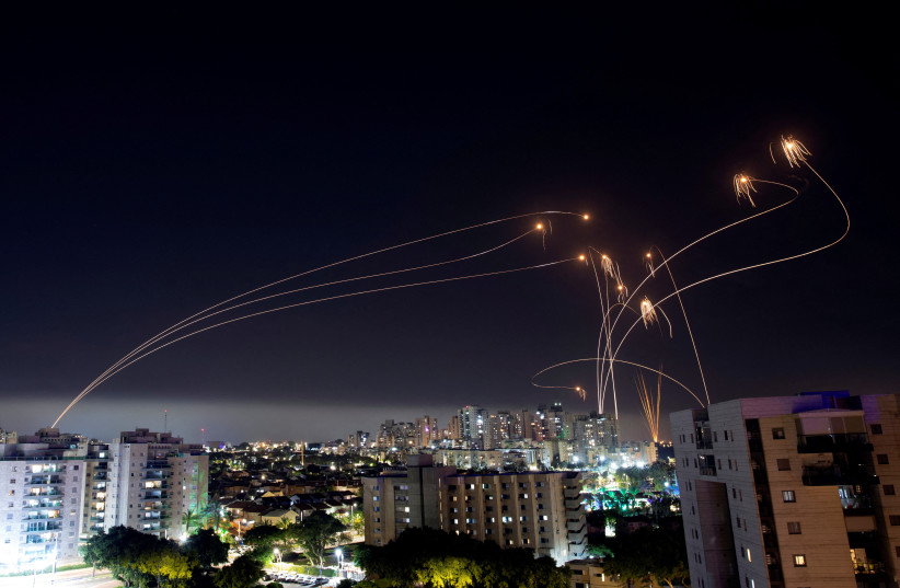  Israel's Iron Dome anti-missile system intercepts rockets launched from the Gaza Strip, as seen from the city of Ashkelon, Israel May 11, 2023 (photo credit: REUTERS/AMIR COHEN)