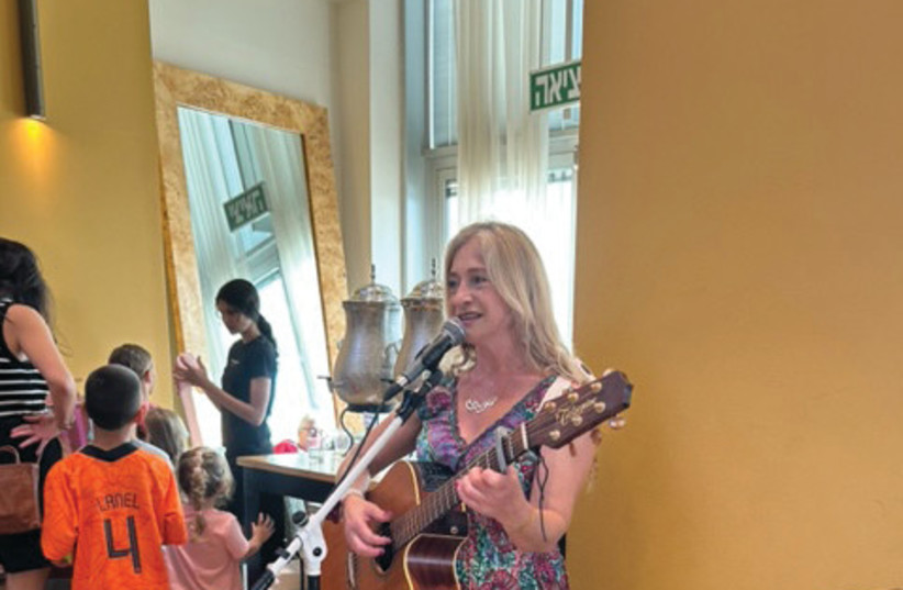  RAHELI WOLLSTEIN sings to Sderot evacuees in a Netanya hotel. (credit: ALEX DEUTSCH)