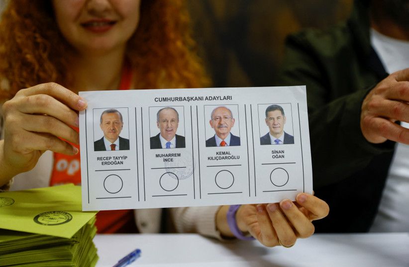  A person holds the ballot at a polling station during the presidential and parliamentary elections, in Istanbul, Turkey May 14, 2023. (credit: REUTERS/KEMAL ASLAN)