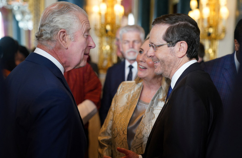  Britain's King Charles speaks with the President of Israel, Isaac Herzog and his wife Michal Herzog, during a reception for overseas guests attending his coronation at Buckingham Palace in London, Britain, May 5, 2023 (photo credit: REUTERS)