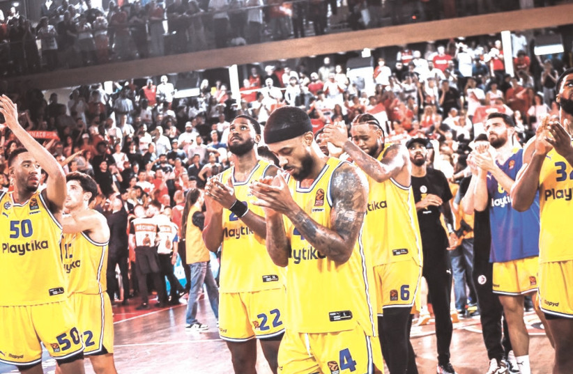  MACCABI TEL AVIV players express their appreciation for their traveling fans following the season-ending Game 5 defeat to AS Monaco at the Salle Gaston Medicin. (photo credit: YEHUDA HALICKMAN)