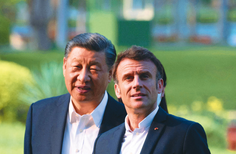  CHINESE PRESIDENT Xi Jinping and France’s President Emmanuel Macron meet in Guangzhou, China, last month. (photo credit: Jacques Witt/Reuters)