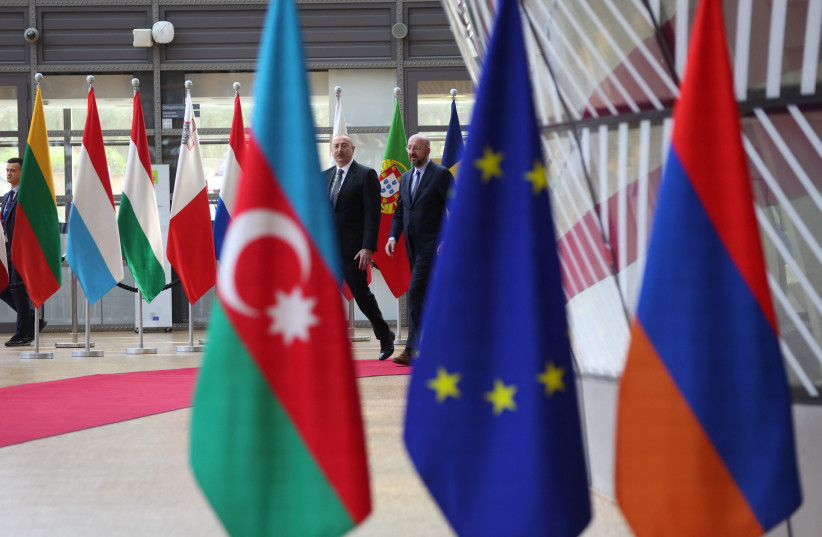  Azerbaijan's President Ilham Aliyev is welcomed by European Council President Charles Michel in Brussels, Belgium May 14, 2023. (photo credit:  REUTERS/JOHANNA GERON)