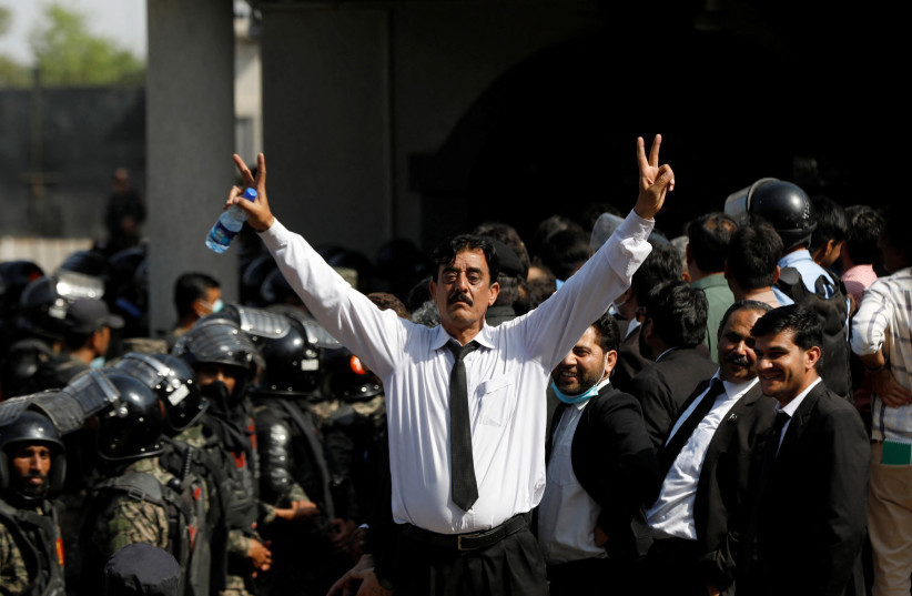  A supporter of Pakistan's former prime minister Imran Khan gestures after the high court ordered Khan's release on bail for two weeks, in the court premises, in Islamabad, Pakistan May 12, 2023. (photo credit: Akhtar Soomro/Reuters)