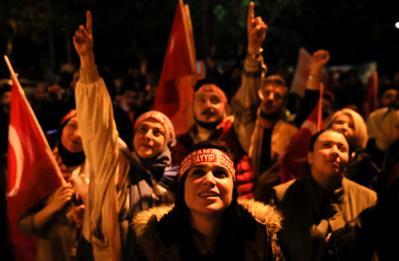  Supporters of Turkish President Tayyip Erdogan and AK Party (AKP) gather on election night, in Istanbul, Turkey May 15, 2023.  (credit: DILARA SENKAYA/REUTERS)