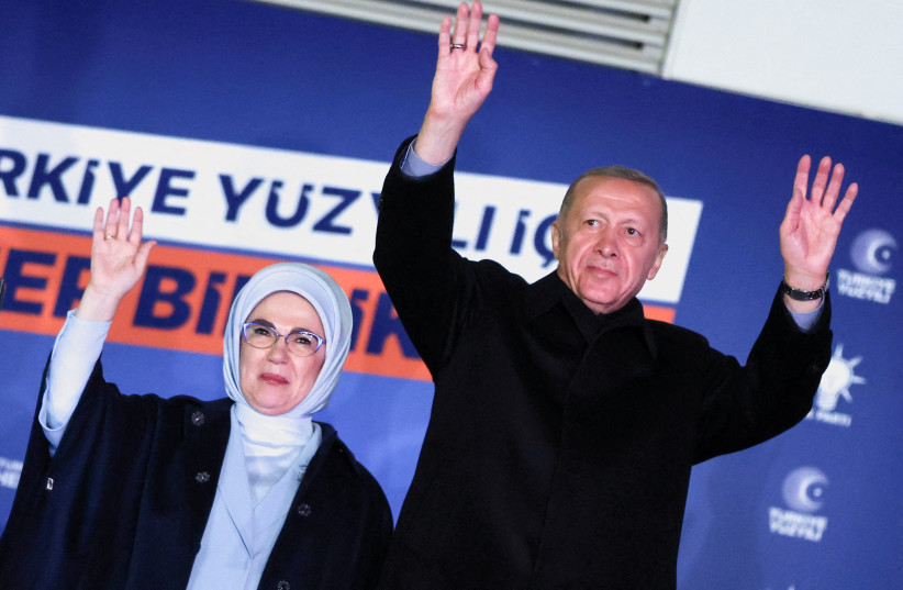  Turkish President Tayyip Erdogan, accompanied by his wife Ermine Erdogan, greets supporters at the AK Party headquarters in Ankara, Turkey May 15, 2023.  (credit: UMIT BEKTAS/REUTERS)