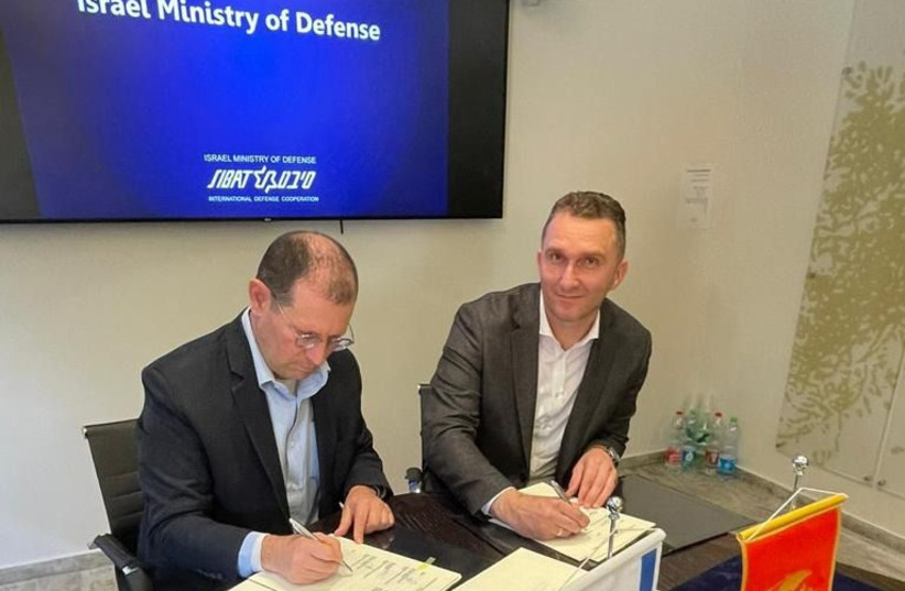  SIBAT director Brig.-Gen. (res.) Yair Kulas and Montenegran Defense Ministry logistics director Col. Vladan Martic are seen signing a deal in Tel Aviv, on May 15, 2023. (credit: Israel Defense Ministry Spokesperson’s Office)