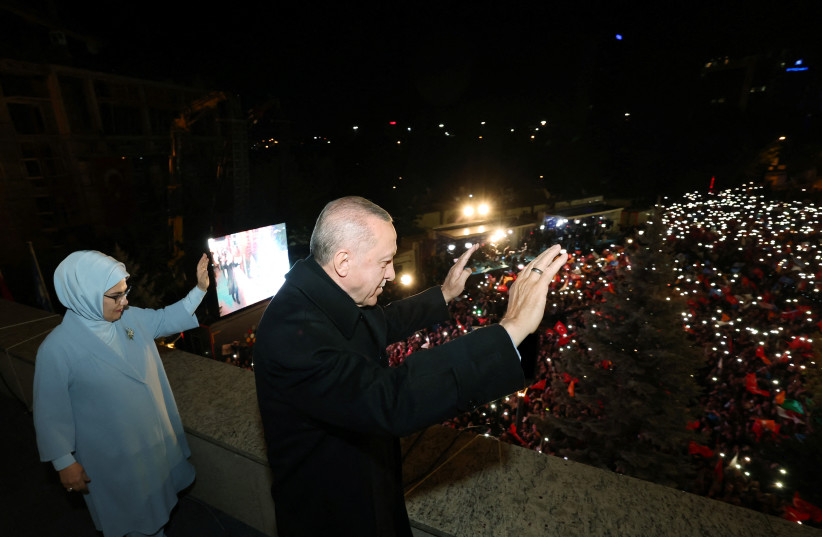 Turkish President Tayyip Erdogan, accompanied by his wife Emine Erdogan, greets his supporters at the AK Party headquarters in Ankara, Turkey May 15, 2023.