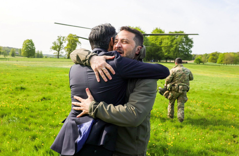  Britain's Prime Minister Rishi Sunak hugs Ukraine's President Volodymyr Zelensky in Aylesbury, Britain, May 15, 2023. (credit: Rishi Sunak via Twitter/Handout via REUTERS)